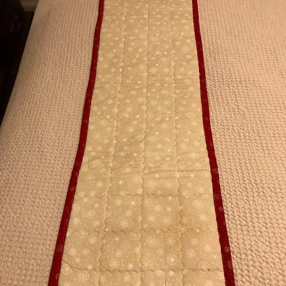 Handcrafted a quilted reversible table runner. Lots of stitching detail